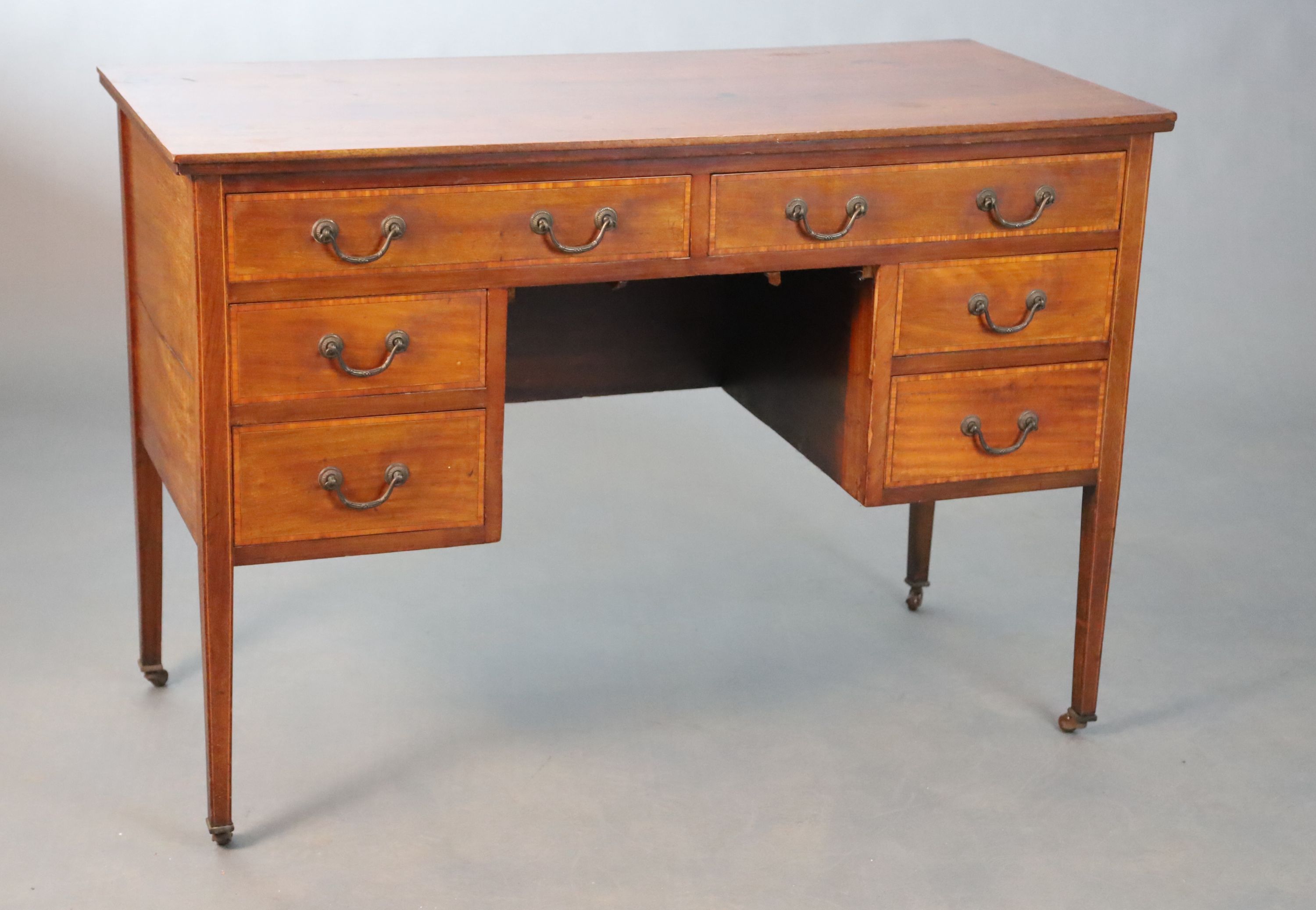 An Edwardian satinwood banded mahogany dressing table, W. 115cm D.82.5cm H.79cm